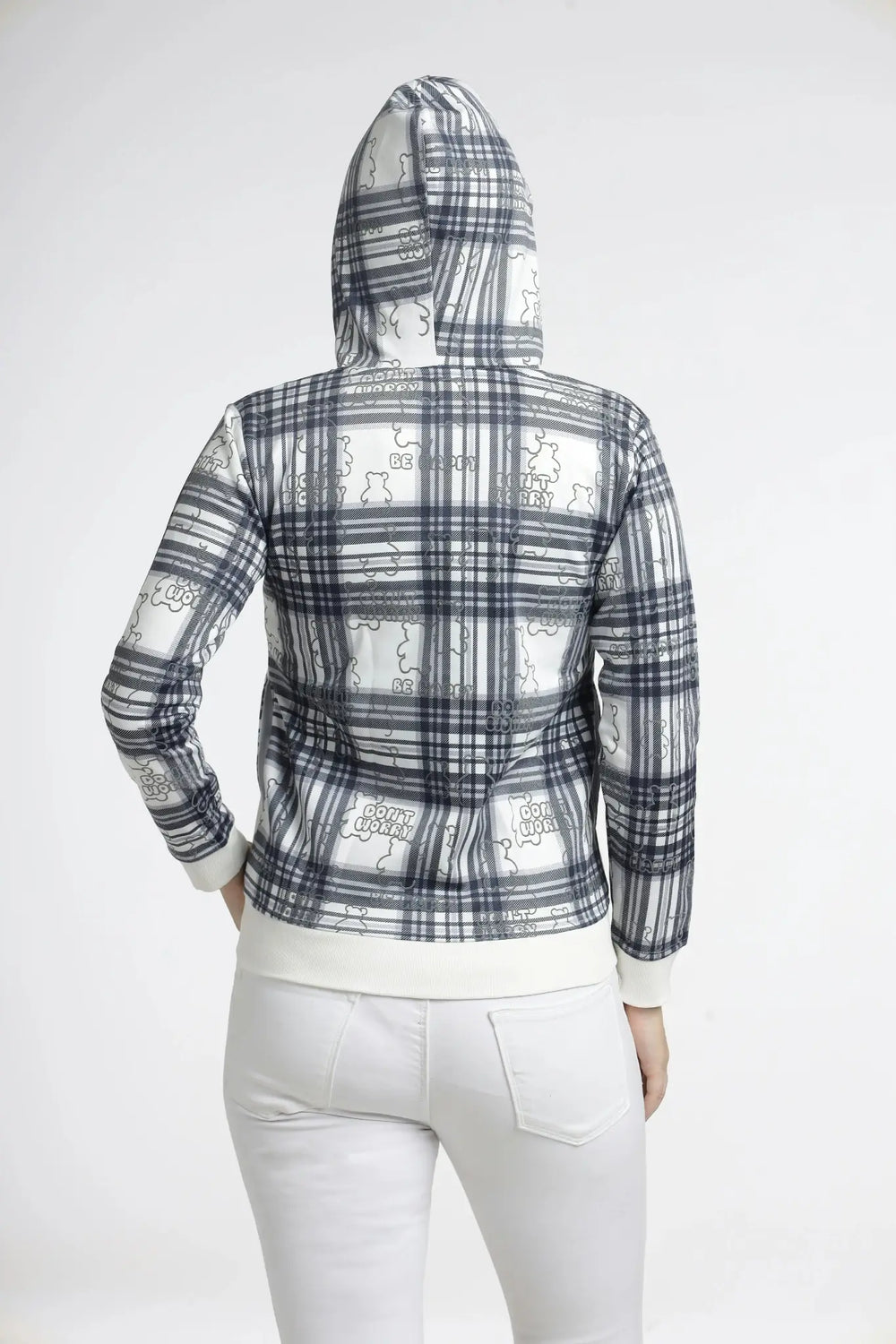 Person wearing a plaid hoodie with a white graphic design on the back against a white background