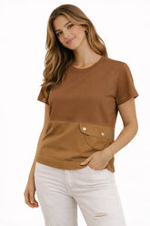 Woman wearing a brown t-shirt with a pocket on a white background