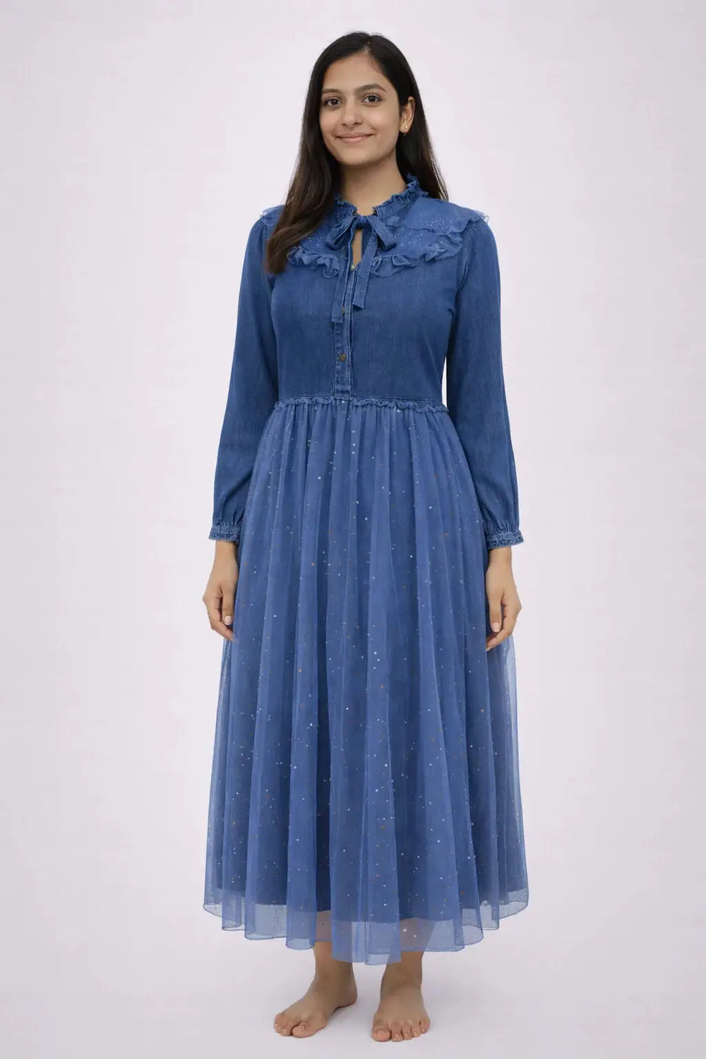 Woman wearing a blue dress with a white background