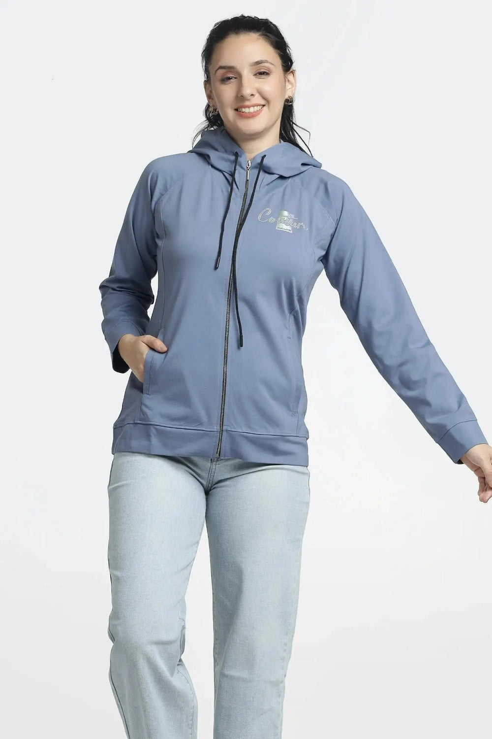 Woman wearing a blue jacket with a brand logo on a white background