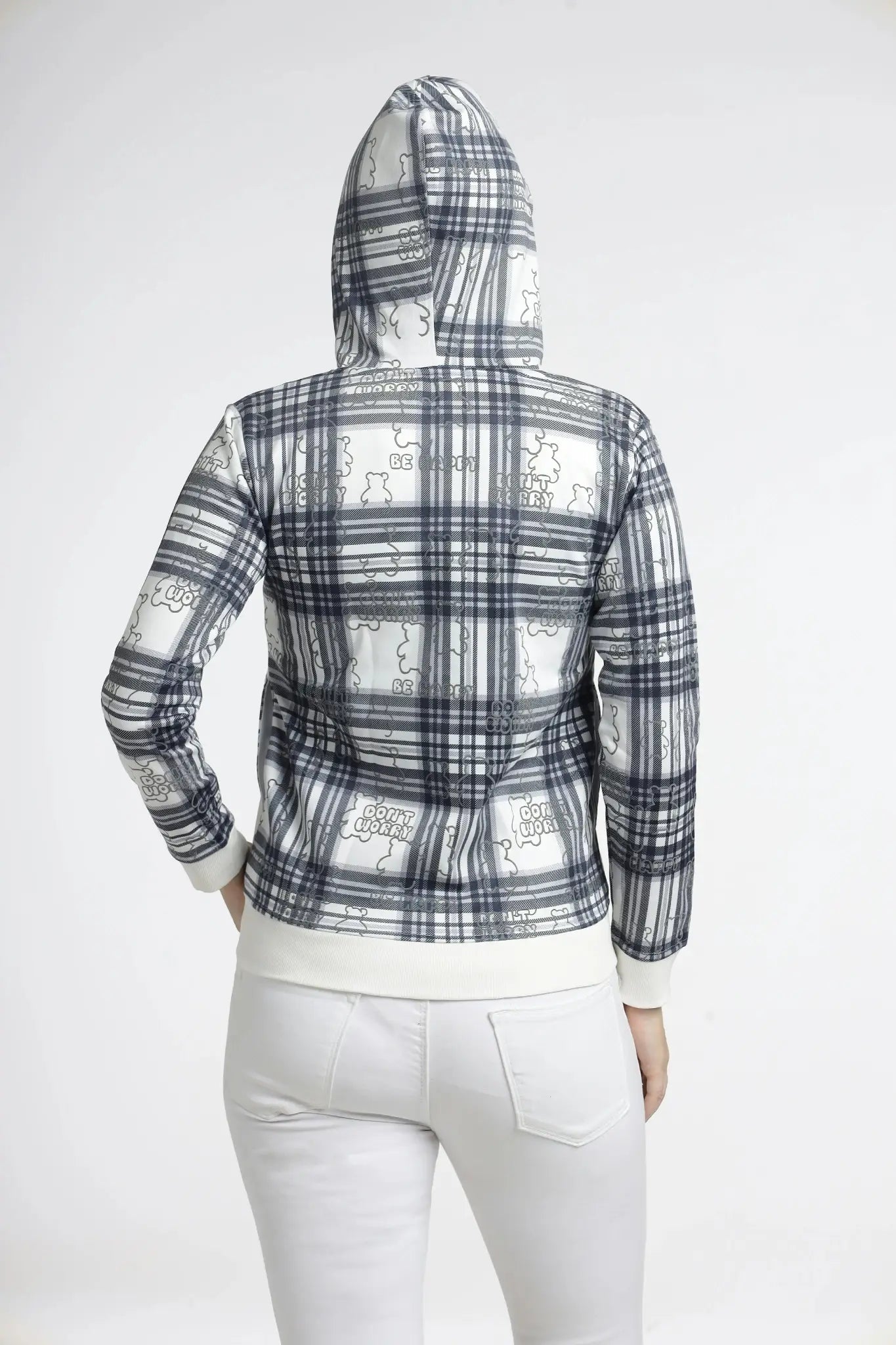 Person wearing a plaid hoodie with a white graphic design on the back against a white background