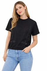 Woman wearing a black t-shirt and blue jeans on a white background