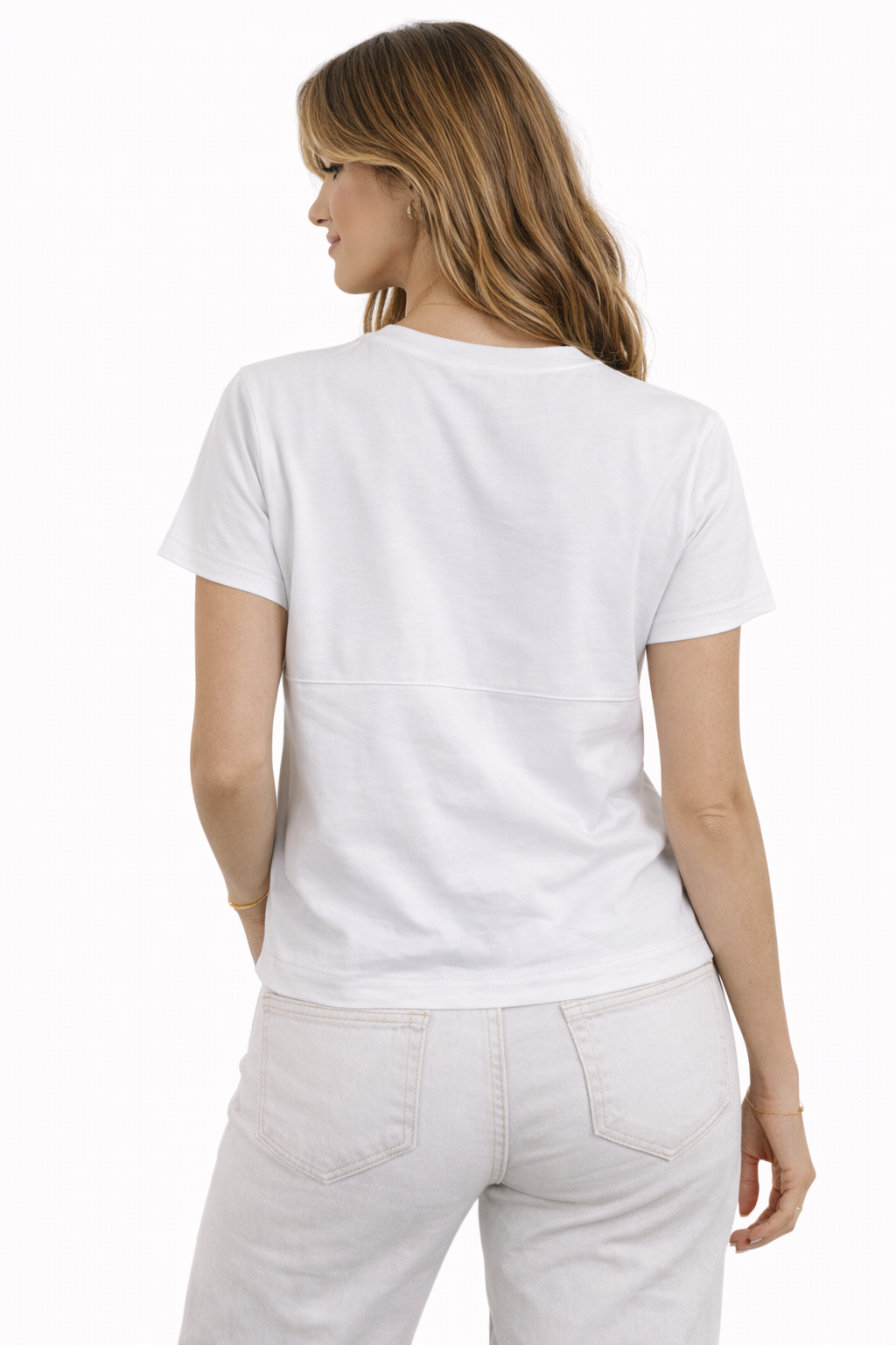 Woman wearing a plain white t-shirt and light-colored pants on a white background