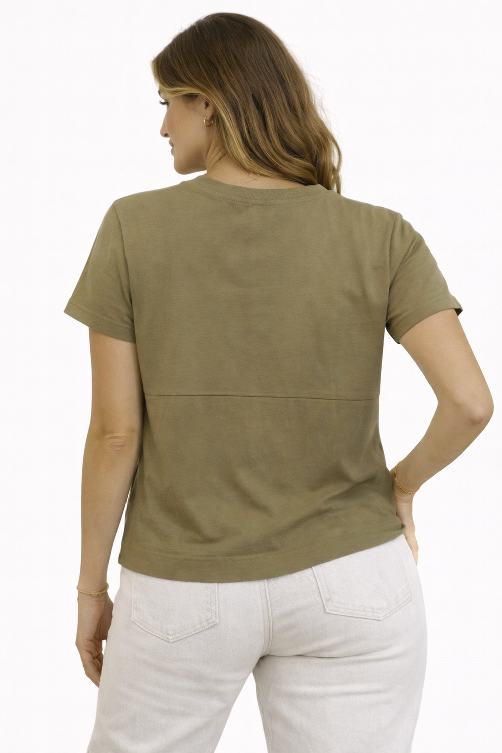 Woman wearing a green t-shirt and white pants on a white background