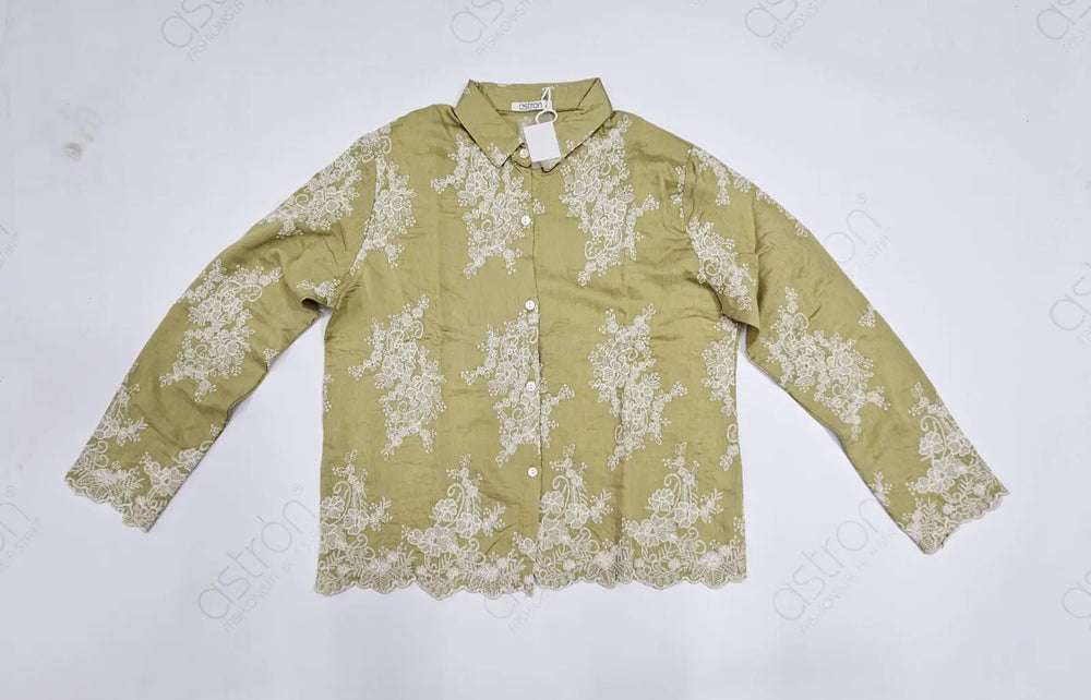 Green shirt with white floral embroider details on a light gray background