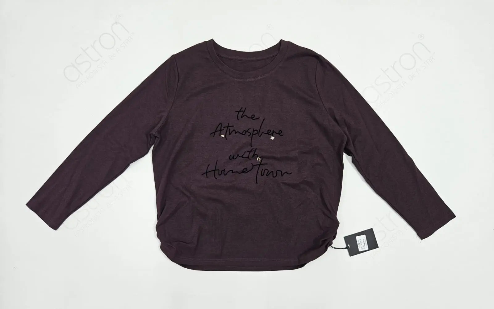 Dark purple long-sleeve shirt with text on a white background