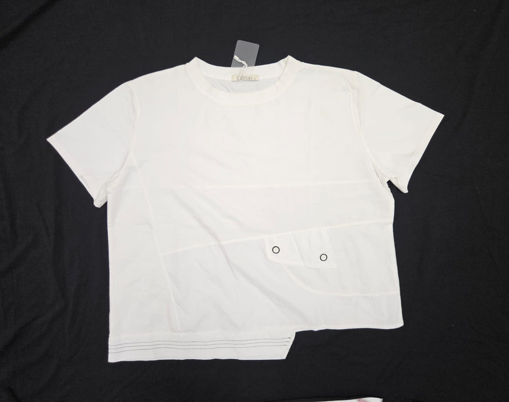 White t-shirt with black buttons on a black background