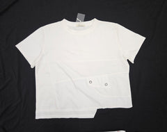White t-shirt with black buttons on a black background